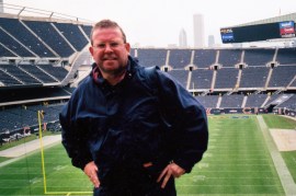 Photo of the author John Rigg as a he is now, in a sports stadium